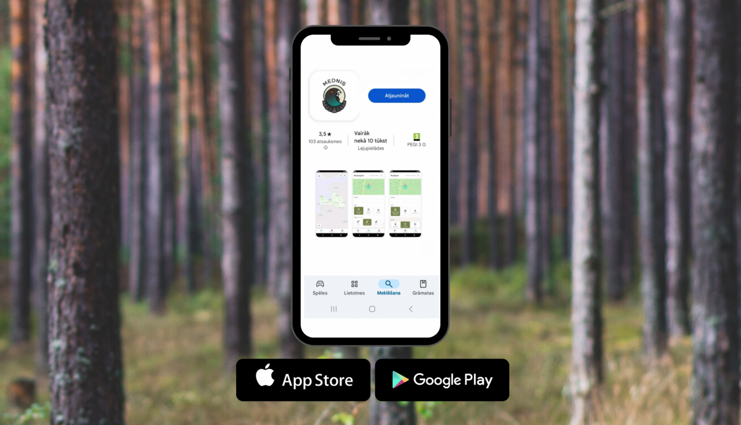Fonā mežs, vidū telefons ar atvērtu lietotni "Mednis"